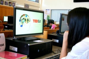 Senior Iris Liu accesses a TED talk at the school library. The iPrism filter, which had previously prevented students from using Youtube and several other sites, has been lifted this year. Photo Illustration by Ashish Samaddar
