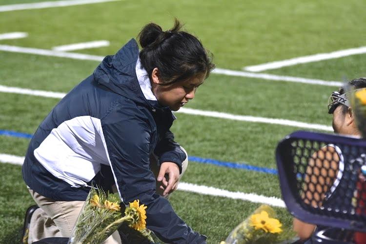Athletic trainer Marie Gishifu examines a Lynbrook High School field hockey player on Oct. 30. Gishifu attended the game to cheer on MVHS and watch over the athletes. 