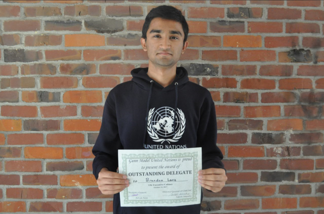 Chandramouly stands with his award. At the MUN conference at Gunn HS Chandramouly received an outstanding delegate award. Photo by Maggie McCormick. 