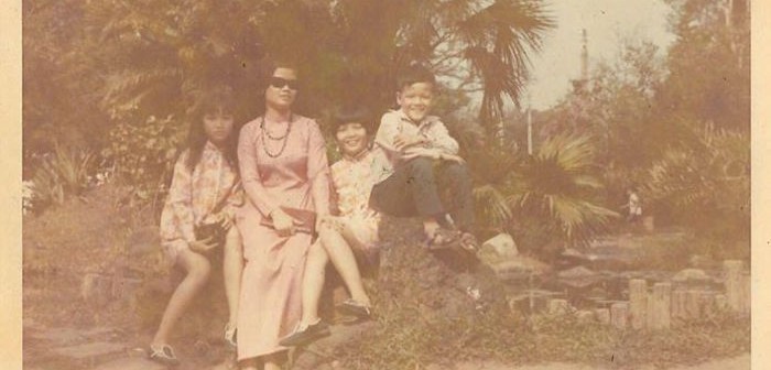 Tu Gustafson, pictured on the very left, sits with her mother and siblings in a Vietnamese garden. The family lived in Vietnam until the fall of Saigon in 1975. 