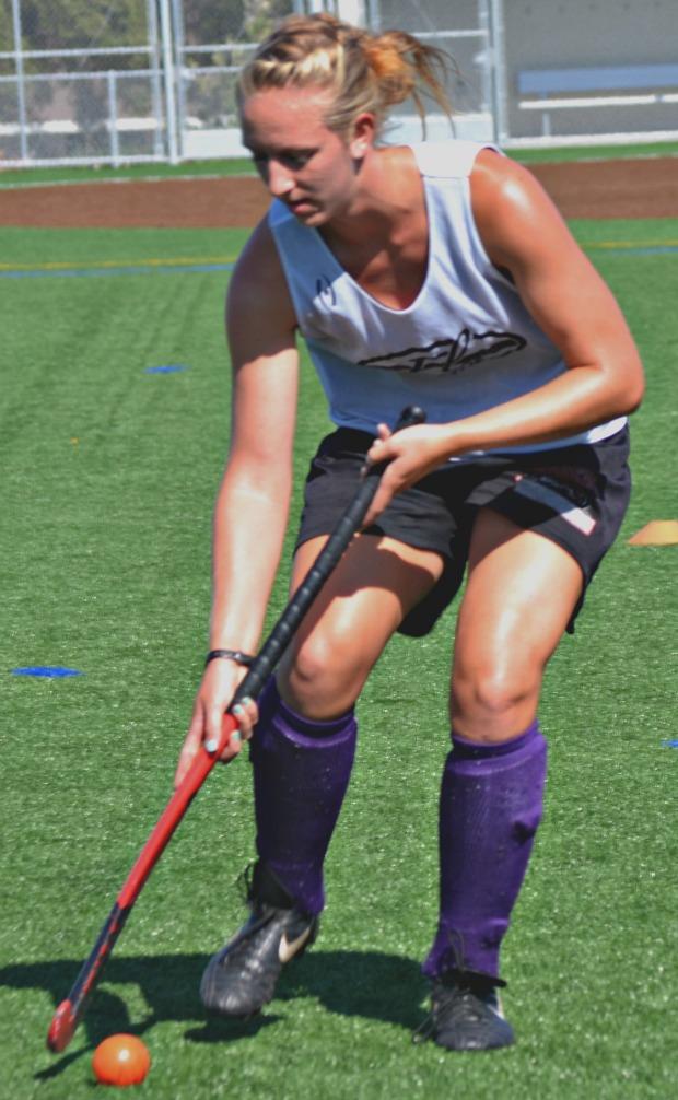 Junior Melissa Foster dribbles the ball during practice on Aug. 21. For the first time in two years, MVHS field hockey will be able to practice and play at home, due to the completion of field construction. Photo by Elia Chen.