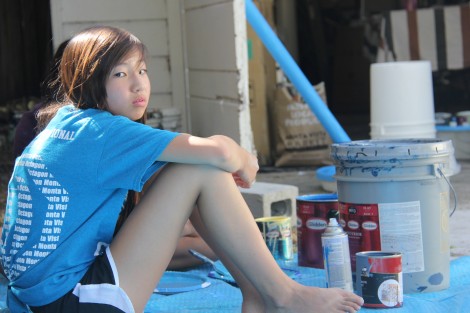 Sophomore Felicia Hou takes a break from the hand-painting the ocean.