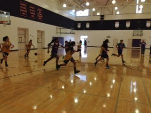 The varsity girls basketball team practices in the field house on Nov. 27. The first home scrimmage was held on Dec. 2 in the main gym. Photo by Lydia Seo.