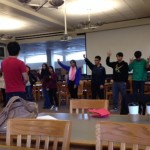 Members playing “cross the line,” a trust building game in which members cross the line if they agree with the statement. Photo by Elia Chen.