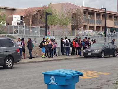Students exit the MVHS campus around noon and wait on Fort Baker Dr. for their rides home. Principal April Scott made an announcement over the school’s PA system about 30 minutes into fifth period to inform students that school would be out of session for the remainder of the day. Photo by Varsha Venkat.