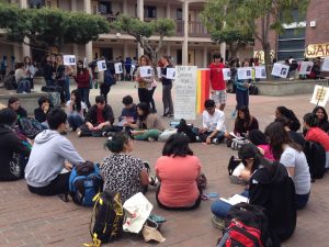  Participants of the Day of Silence gather in the academic court on April 11 to host a vigil acknowledging silenced LGBTQ youth. The annual vigil is open to all students and allows them to show respect for the lesbian, gay, bisexual, transgender and queer community. Photo by Kristin Chang 