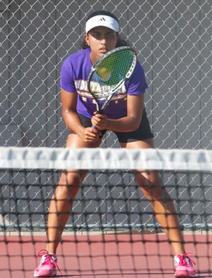 Senior Aishwarya Sankar focuses on returning her opponent’s serve, keeping her eye on the ball at the game against Homestead High School on Sept. 11. Sankar dominated throughout the match and won seemingly effortlessly. Photo by Sanjana Murthy. 