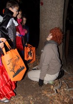 An intern dressed as the cowardly Lion talks to the children. The Lion expresses relief that they were harmless, and then sends them off with a small treat. Photo by Dylan Tsai.