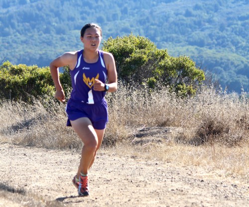 Improving by 14 seconds from her past record, senior Jenny Xu achieved a new personal best. According to Xu, she ran her fastest time in Crystal Springs when she was a freshman and did not improve for the following two years until this season. Photo by Sharon Tung.