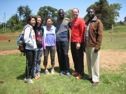 The girls pose for a picture with David Rudisha (center), the current world record holder for the 800 meter. 