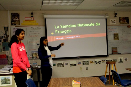 During lunch in room B109, senior Rhea Choudhury introduces the Jeopardy game she and other officers of the club made. She then splits the club members into two groups to play the game. Photo by Sharon Tung.