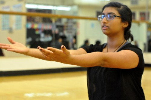 Yoga club president junior Kavya Aswadhati demonstrates a pose on Dec. 1. While the club began two years ago, it did not have an active presence on campus until this year. Photo by Alina Abidi.