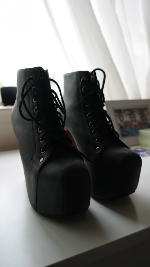 Leung's Jeffrey Campbell boots sit proudly by the window. These are her favorite pair of shoes that she owns. Photo by Rhonda Mak. 