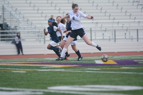 Junior Alissa Paterson dribbles the ball down the field during the game against Lynbrook High School on Jan. 15. With a final score of 1-0, the game was the team's first league win. Photo by Justin Kim.