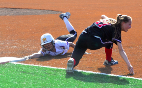 Junior Monica McCarthy slides on to first base on March 11. The Matadors defeated Aragon High School 11-6 after scoring five runs in the first inning.