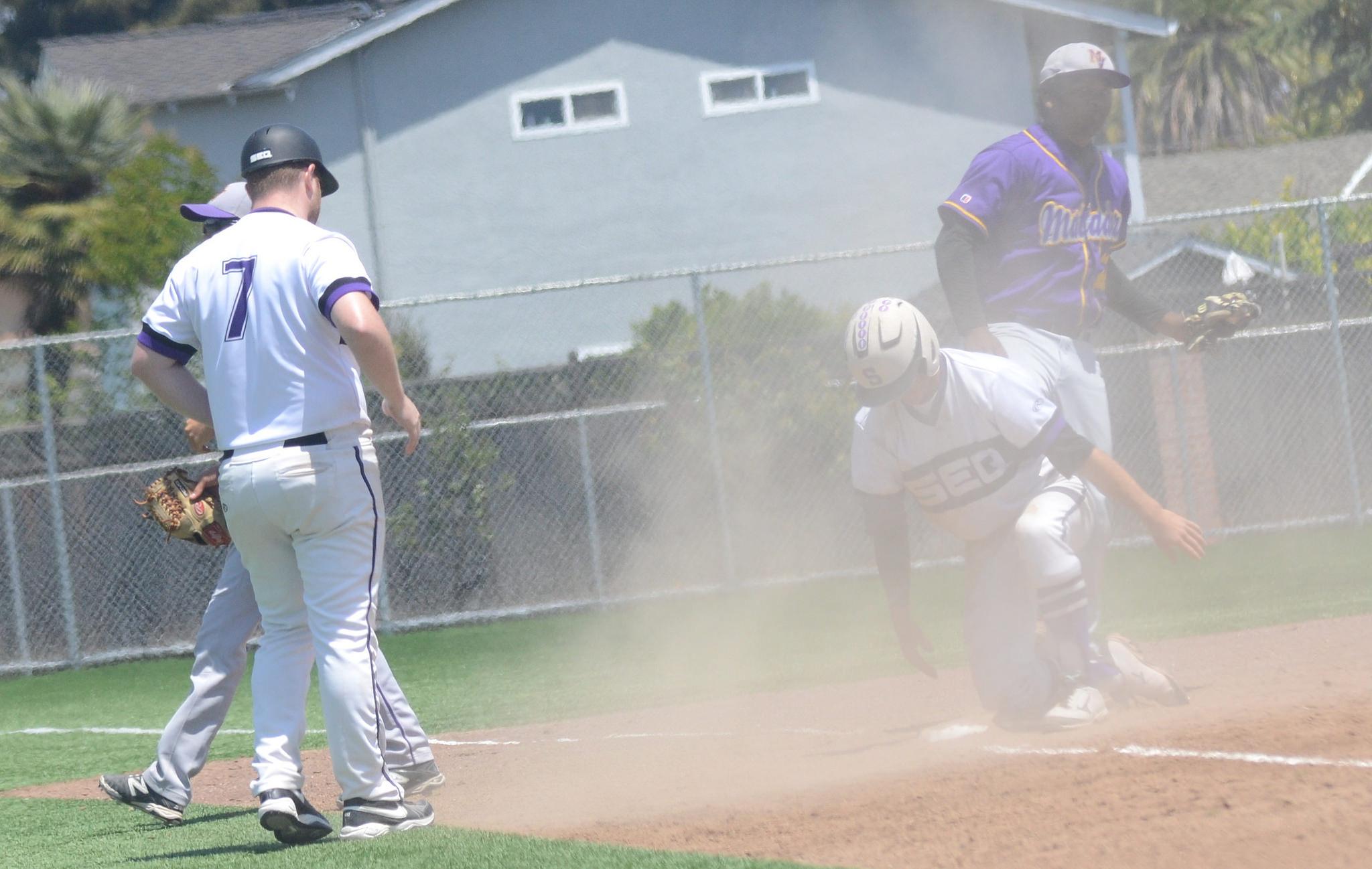A Cherokee baserunner slides into third safely. Having runner on first and third with no outs in the bottom of the sixth inning gave them the upper hand. Photo by Pranav Iyer. 