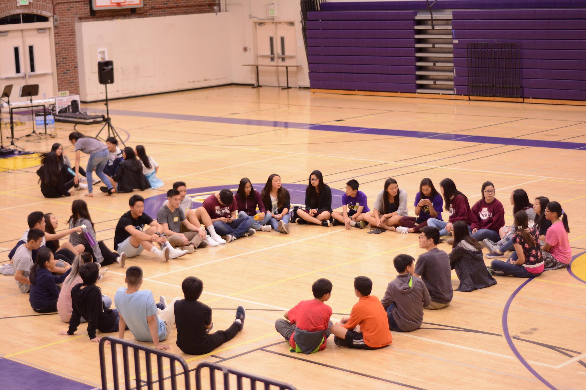 Participants from MVHS and KMS sit in a circle to debrief about the sermon and get to know the different clubs. Roots club? officers encouraged the middle schoolers to ask any questions they had about MVHS Christian club, or high school in general. Photo by Justin Kim 