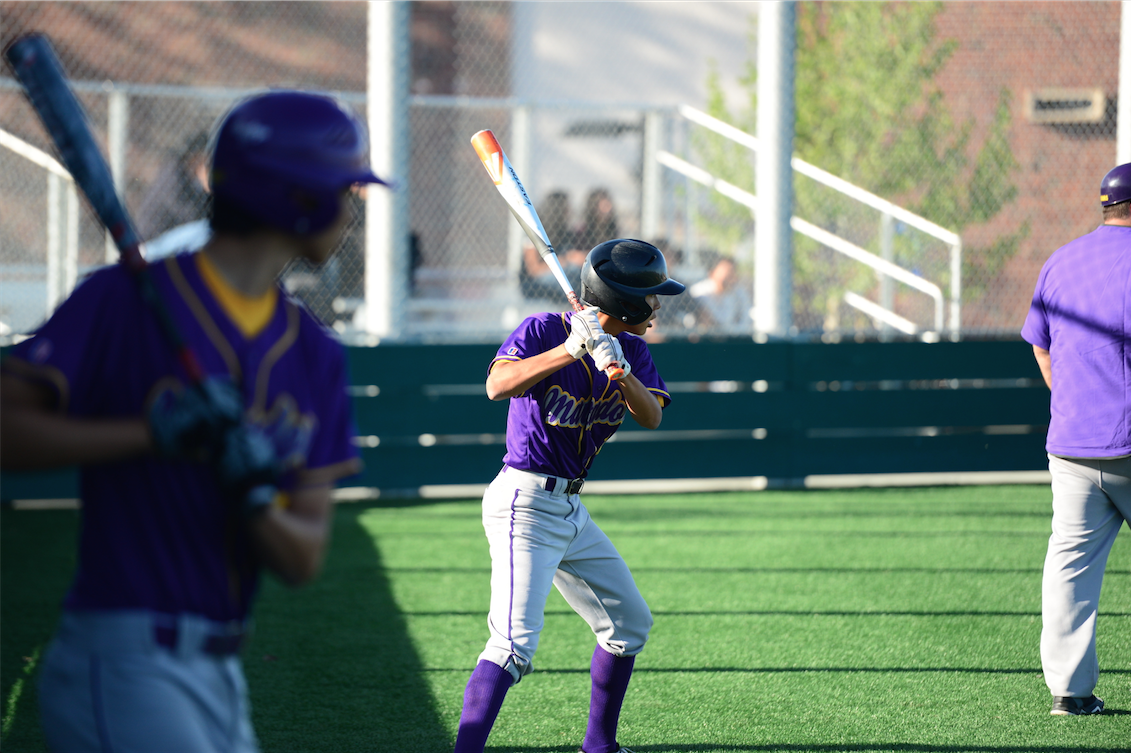 Sophomore Josh Huang (left) and Junior Allen Iwamoto (right) prepare for their at-bat. After a run in the first, the Matadors offense cooled down, a large part due to the dominant pitching of the Titans. Photo by Pranav Iyer. 