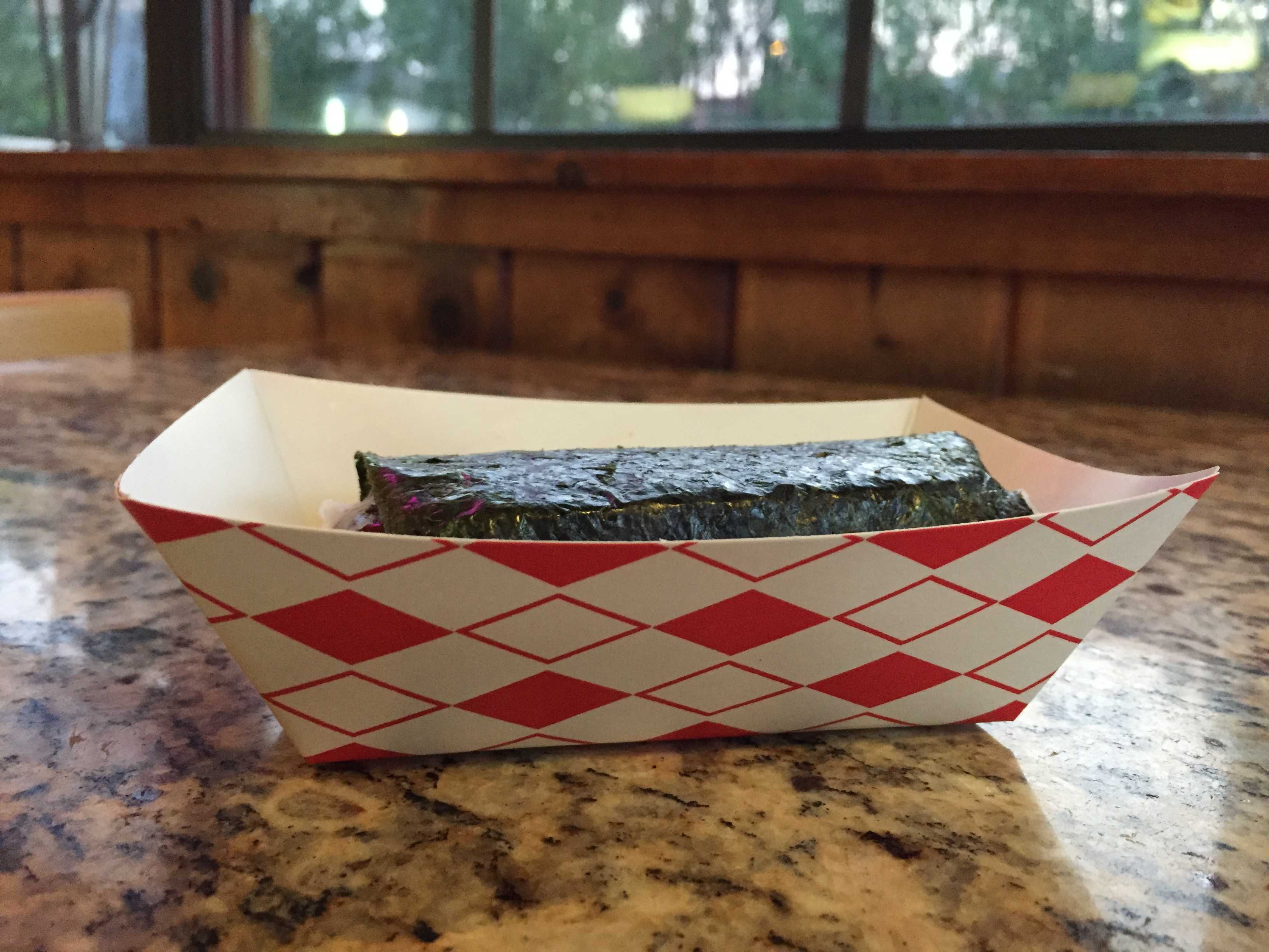 The spam Musubi is a flattened five-inch roll of rice and a slab of spam. The dish is $1.85, a relatively fair price. Photos by Caitlyn Tjong.