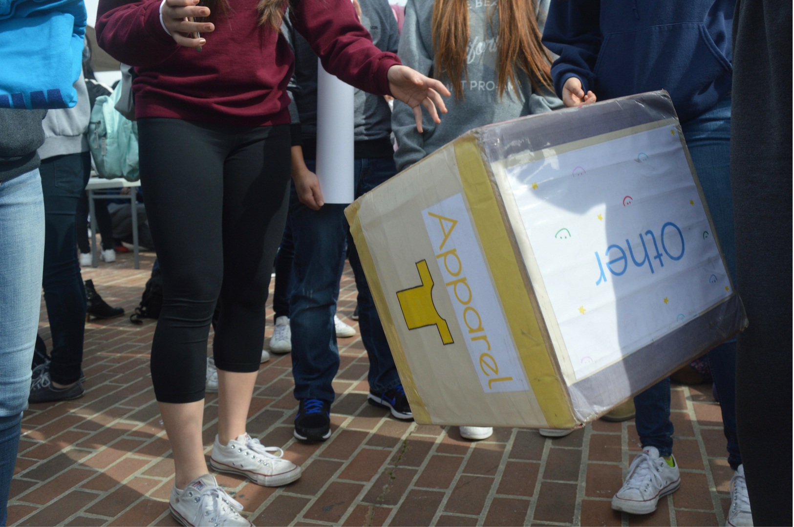 A student tosses the giant dice to receive a reward at Interact club’s booth. The different sides of the dice offered rewards of cookies, free t-shirts and more.