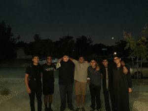 On Halloween night, the 7 boysi smile for a picture after putting in hours of hard work on this project. Photo by Sreya Kumar