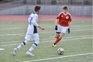 Senior Arjun Mathur dribbles in front of a GHS defender. GHS stopped MVHS from scoring any goals in this game. 