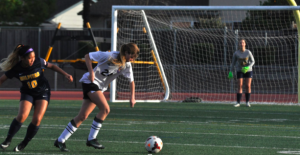 #24 Skylar Polshay steals the ball from a MHS player.