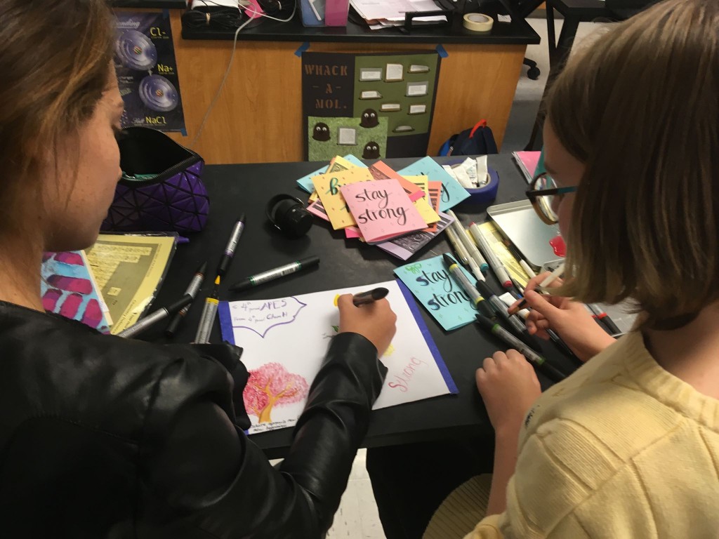 Students write letters to the Parkland survivors on colorful pieces of paper decorated with the phrases “Stay Strong” and “Persevere.” They then put the paper into a handmade, colorful envelope, ready to be sent to the MSDHS students. Photo by Sreya Kumar.