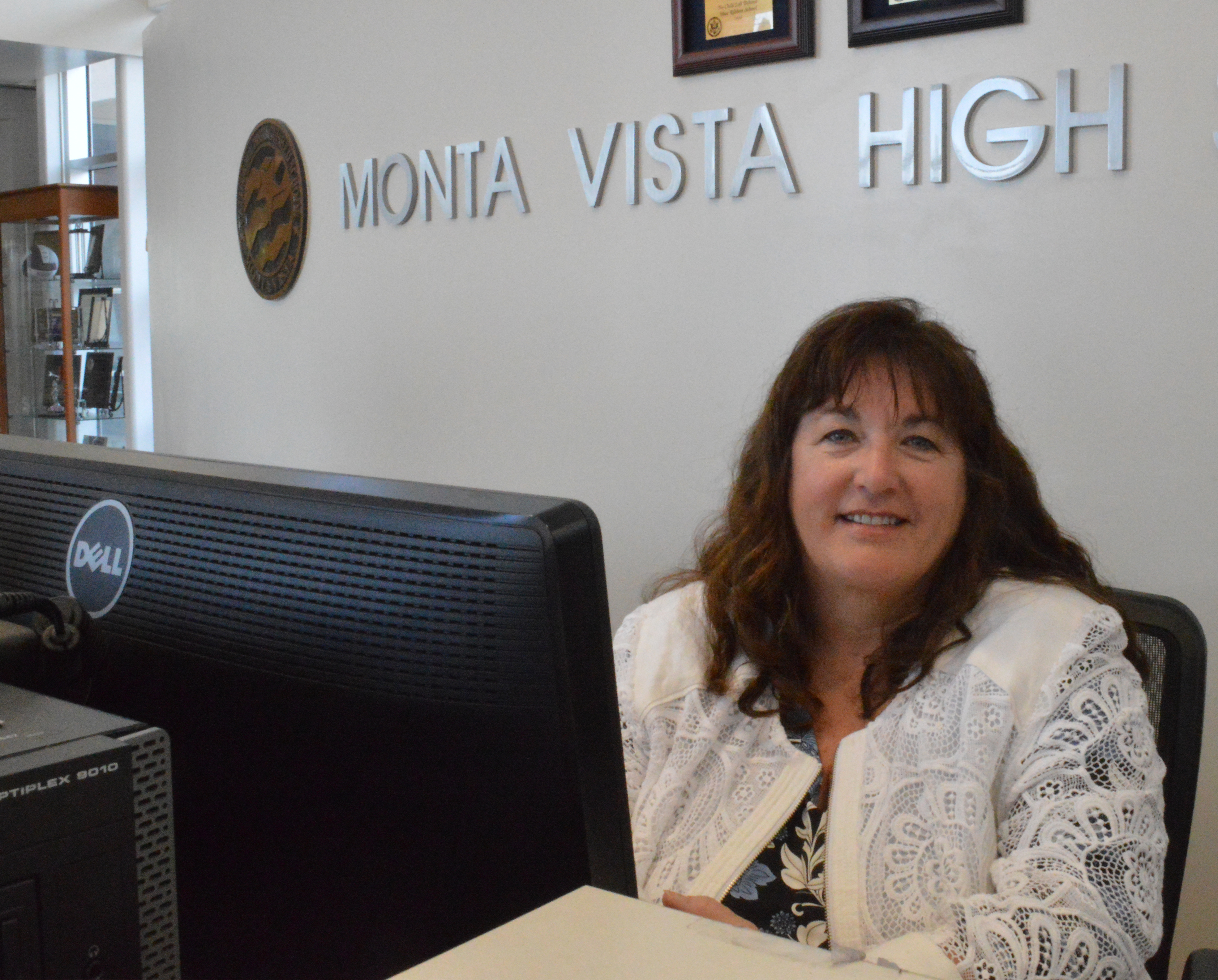 Giarritta poses at the front desk of the MVHS lobby. A staff member at MVHS for two years, Giarritta is the second winner of the 2018 Employee of the Year award. Photo by Maggie McCormick.