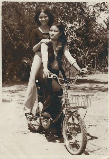 Gustafson rides her bike with her younger sister sitting behind. For most of her life, Gustafson's siblings have been her biggest supporters. 